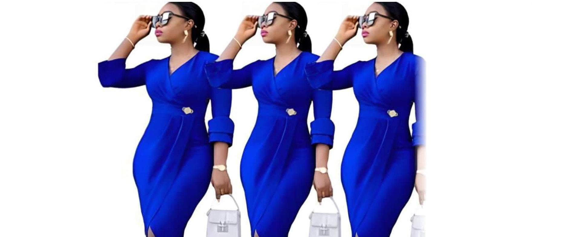 Woman in a vibrant blue dress with rolled sleeves, holding a white handbag, face blurred for privacy.